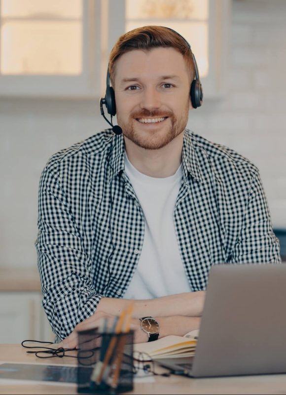handsome-glad-man-customer-support-manager-gives-a-2022-01-27-18-15-48-utc-e1660552801998.jpg